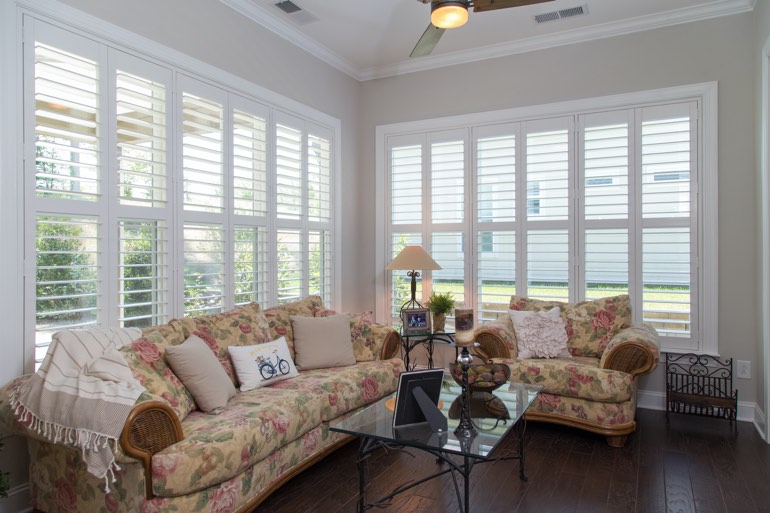 Sunroom with plantation shutters in Bluff City.